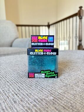 NeeDoh Nice Cube Glitter & Glow Super Solid Squish Blue Glitter